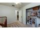 Bedroom with closet, shelving, and a view of another room at 11935 N 148Th Ave, Surprise, AZ 85379