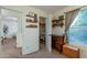 Bedroom with closet, dresser, and window offering natural light at 11935 N 148Th Ave, Surprise, AZ 85379