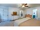 Bright bedroom with double bed, dresser, and access to a bathroom at 11935 N 148Th Ave, Surprise, AZ 85379