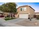 Two-story house with a landscaped yard and a two-car garage at 11935 N 148Th Ave, Surprise, AZ 85379