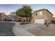 Two-story house with a landscaped yard and a two-car garage at 11935 N 148Th Ave, Surprise, AZ 85379