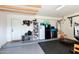 Organized garage with storage, mini-fridge, and exercise area at 11935 N 148Th Ave, Surprise, AZ 85379