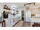 Kitchen with white cabinets, pantry, and stainless steel appliances at 11935 N 148Th Ave, Surprise, AZ 85379