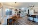 Bright kitchen with island, white cabinets, and wood-look floors at 11935 N 148Th Ave, Surprise, AZ 85379