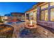 Stunning backyard with a pool, fire pit, and patio at 12007 W Creosote Dr, Peoria, AZ 85383