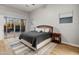 Bedroom with sliding glass doors leading to the pool and patio at 12007 W Creosote Dr, Peoria, AZ 85383