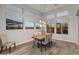 Bright dining area with wood table and built in window seating at 12007 W Creosote Dr, Peoria, AZ 85383