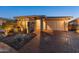 Attractive single-story home with a stone facade and landscaped front yard at 12007 W Creosote Dr, Peoria, AZ 85383