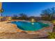 Relaxing pool area with water feature and spacious patio at 12007 W Creosote Dr, Peoria, AZ 85383