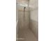 Spacious shower with stone accent and a rain shower head at 12007 W Creosote Dr, Peoria, AZ 85383