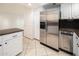 Kitchen with stainless steel appliances and white cabinets at 12212 N Paradise Village S Pkwy # 134, Phoenix, AZ 85032