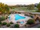 Relaxing pool area with a waterfall feature and ample seating at 12212 N Paradise Village S Pkwy # 134, Phoenix, AZ 85032