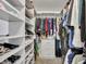 Large walk-in closet with ample shelving and drawers at 12526 W Paintbrush Dr, Sun City West, AZ 85375