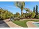 Private hot tub nestled in a lush, tropical backyard at 12526 W Paintbrush Dr, Sun City West, AZ 85375