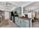 Modern kitchen with light green cabinets and butcher block counter at 12526 W Paintbrush Dr, Sun City West, AZ 85375