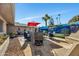 Relaxing patio with seating area and painted mural wall at 12526 W Paintbrush Dr, Sun City West, AZ 85375