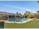 Expansive backyard oasis with a kidney shaped pool at 12526 W Paintbrush Dr, Sun City West, AZ 85375