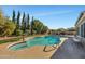 Inviting kidney shaped pool with a large patio area at 12526 W Paintbrush Dr, Sun City West, AZ 85375