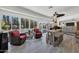 Bright sunroom with pool access and comfortable seating at 12526 W Paintbrush Dr, Sun City West, AZ 85375