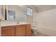 Bathroom with shower/tub combo and wood vanity at 12618 W Catalina Dr, Avondale, AZ 85392