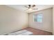 Spacious bedroom featuring a ceiling fan and window blinds at 12618 W Catalina Dr, Avondale, AZ 85392