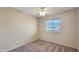 Simple bedroom with ceiling fan and carpet at 12618 W Catalina Dr, Avondale, AZ 85392