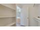 Spacious bedroom closet with built-in shelving at 12618 W Catalina Dr, Avondale, AZ 85392