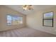 Spacious bedroom with carpet and large windows at 12618 W Catalina Dr, Avondale, AZ 85392