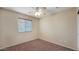 Bright bedroom with neutral walls and carpet flooring at 12618 W Catalina Dr, Avondale, AZ 85392