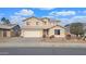 Two-story house with a large yard and a two-car garage at 12618 W Catalina Dr, Avondale, AZ 85392