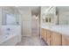 Main bathroom with double vanity and walk-in shower at 12618 W Catalina Dr, Avondale, AZ 85392