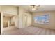 Main bedroom with ceiling fan and carpet at 12618 W Catalina Dr, Avondale, AZ 85392