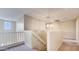 Upstairs hallway with carpet and lighting fixture at 12618 W Catalina Dr, Avondale, AZ 85392