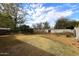 Spacious backyard with mature trees and a partially fenced area at 1312 E Coolidge St, Phoenix, AZ 85014