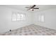 Bright bedroom with tile floors, ceiling fan, and window shutters at 1312 E Coolidge St, Phoenix, AZ 85014