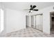 Bedroom with tile floors, ceiling fan and mirrored closet doors at 1312 E Coolidge St, Phoenix, AZ 85014