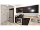 Modern kitchen with stainless steel appliances and granite countertops at 1312 E Coolidge St, Phoenix, AZ 85014