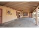 Covered patio with tile floor, ceiling fan and doors leading to backyard at 1312 E Coolidge St, Phoenix, AZ 85014