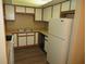 Kitchen with wood cabinets and appliances at 1340 N Recker Rd # 243, Mesa, AZ 85205