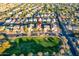 Aerial view of a two story house with solar panels, near a park at 13627 N 150Th Ave, Surprise, AZ 85379