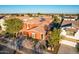 Two-story house with solar panels and landscaped yard, located in a quiet neighborhood at 13627 N 150Th Ave, Surprise, AZ 85379