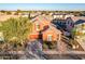 Two-story house with solar panels and landscaped yard, located in a quiet neighborhood at 13627 N 150Th Ave, Surprise, AZ 85379