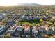 Aerial view of a two story house with solar panels, near a park at 13627 N 150Th Ave, Surprise, AZ 85379