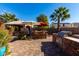 Outdoor kitchen, hot tub, and seating area at 13627 N 150Th Ave, Surprise, AZ 85379