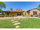 Exterior of community center with landscaping and lawn at 13627 N 150Th Ave, Surprise, AZ 85379