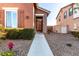 Front entry with brick columns, wrought-iron gate, and walkway at 13627 N 150Th Ave, Surprise, AZ 85379