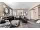 Bright living room featuring a stone accent wall and comfy furniture at 13627 N 150Th Ave, Surprise, AZ 85379