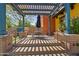 Small patio seating area with umbrella and pergola at 13627 N 150Th Ave, Surprise, AZ 85379