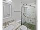 Modern bathroom with marble vanity and pebble floor shower at 1437 N 44Th St, Phoenix, AZ 85008