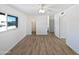 Bright bedroom with wood-look floors and a ceiling fan at 1437 N 44Th St, Phoenix, AZ 85008